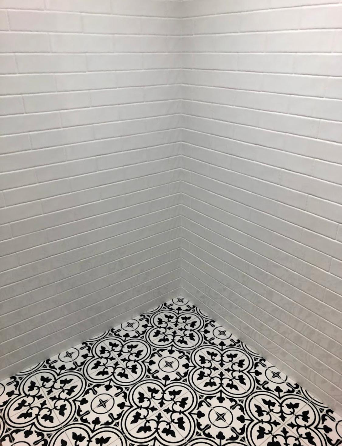 Subway tile shower with patterned encaustic-look floor — Perth Tiling WA project